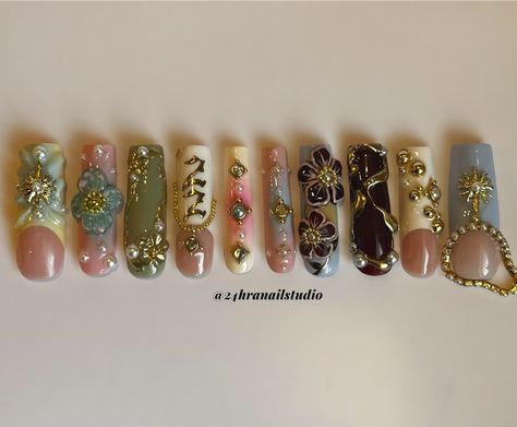 Your favorite nail tech turned 22✨🌸☀️✨ Custom birthday set for myself @zahrazshahh Here’s a rundown of the inspiration behind this set: Zahra in Arabic means flower so i based it around 3D flowers, I was born on the summer solstice so i added some gold sun charms, and my birth stone is a pearl so i added a few for embellishment. Everything is hand sculpted and painted by me ✨ #njnailtech #bestofnjbeauty #njnails #gelxnails #custompressons #custombirthdaynails #birthdaynails #nycnails #n... Long Junk Nails With Charms, 22 Nails Birthday, Gold Nail Charms, Nails With Numbers On Them, Nail Page Name Ideas, Nail With Charms, Nail Art 2024, Gold Charm Nails, Arabic Nails