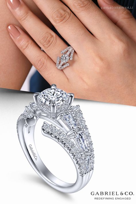 This spectacular split shank engagement ring sports three rows of accent diamonds to augment the sparkle of your round center stone. Tapered baguettes that increase in size as they approach the center stone ornament the central band while round accent diamonds fan out above and below. Incorporating surprise stones in the basket, this 14K white gold setting shines with 1.30cts of diamonds. ER15409R4W44JJ Open Halo Ring With Brilliant Cut For Anniversary, Wedding Bands For Split Shank Rings, Round Diamond Engagement Rings Halo Split Shank, Halo Split Shank Engagement Ring, Split Shank Diamond Ring, Stone Ornaments, Split Shank Engagement Rings, Split Shank, Round Engagement Rings