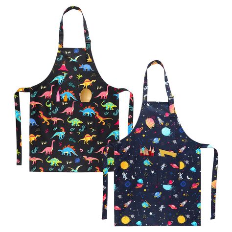 PRICES MAY VARY. LOVELY PATTERN DESIGN - Cute kids' baking aprons are designed with dinosaur and space patterns, including Various different types of dinosaurs and different planets, stars, rockets, and astronauts, which can appeal to kids very much, suitable for boys and girls ADJUSTABLE SIZE - Our apron for kids is 24.4 inches long x 17.7 inches wide, large enough to fit different ages of kids, without making them uncomfortable when putting on COMFORT AND STYLE - Our Kid’s Apron is made of pol Baking Aprons, Child Apron Pattern, Cute Cooking, Apron Cute, Branded Aprons, Cooking Aprons, Toddler Painting, Kids Baking, Toddler Apron