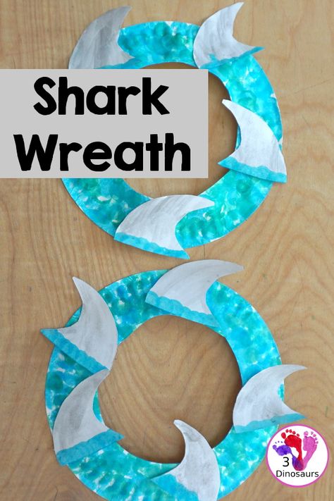 Shark Fin Wreath Craft for Shark Week | 3 Dinosaurs Shark Week Art Projects For Kids, Toddler Shark Craft, Shark Week For Toddlers, Shark Craft For Preschool, Easy Shark Craft, Shark Week Crafts For Toddlers, Shark Art For Toddlers, Shark Art Preschool, Easy Shark Crafts For Kids