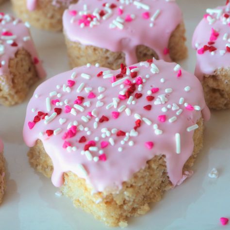 A close up shot of a heart shaped rice krispie treat that is dripping with light pink icing and sprinkled with red, white and pink sprinkles. Crispy Treats Recipe, Pink Sprinkles, Homemade Marshmallow, Marshmallow Treats, Pink Icing, Homemade Marshmallows, Rice Crispy Treats, Crispy Treats, Rice Krispie Treats