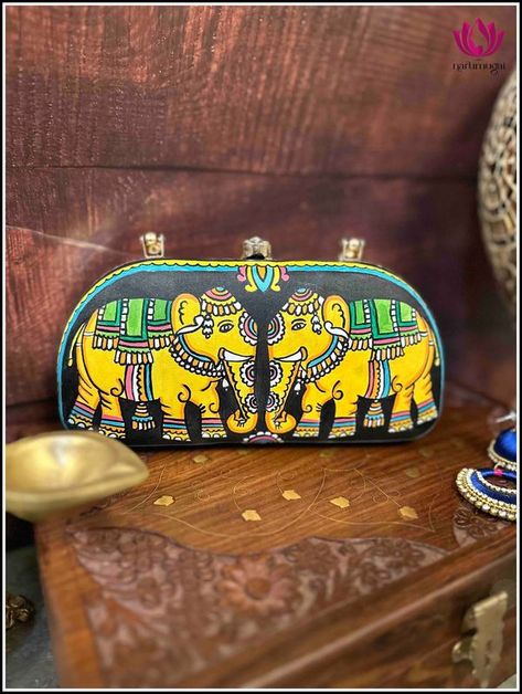 🌟 Hand painted clutches 😍✨ 
💖 Carry a piece of art to complete your outfit 👗✨
https://narumugai.com/collections/clutches Tholu Bommalata, Painted Clutches, Painted Handbag, Painted Purse, Metallic Frame, Bright Colors, Snap Closure, Clutches, Metal Frame