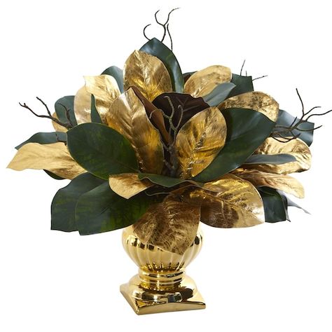 Buy the 18" Magnolia Leaf Arrangement in Gold Planter at Michaels. com. Large green and gold leaves sit tightly packed together and hang slightly over an equally stunning gold planter in this beautiful magnolia leaf artificial arrangement. Large green and gold leaves sit tightly packed together and hang slightly over an equally stunning gold planter in this beautiful magnolia leaf artificial arrangement. Considered warm, elegant, and once a symbol of wealth, the color gold is versatile and can b Bold Centerpieces, Gold Planter, Symbol Of Wealth, Magnolia Leaf, Fake Plants Decor, Artificial Foliage, Floor Plants, Gold Vases, Magnolia Leaves