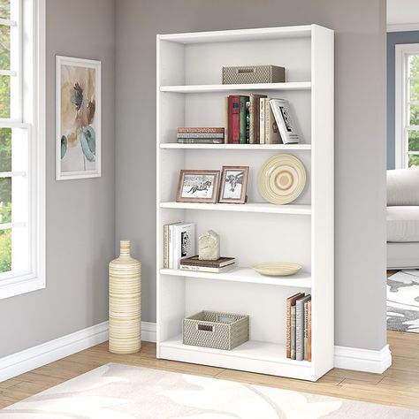 You'll love the Universal Bookcase Standard Bookcase at Wayfair - Great Deals on all Furniture products with Free Shipping on most stuff, even the big stuff. Minimalist Library, White Bookshelf, White Bookshelves, 5 Shelf Bookcase, Tall Bookcases, Wood Bookshelves, Cube Bookcase, White Bookcase, Shelf Bookcase