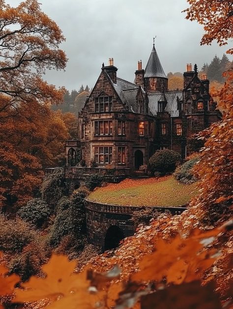 This stunning image captures a grand Gothic mansion nestled among vibrant autumn leaves. The architectural details of the mansion stand out against the backdrop of fiery orange and yellow foliage, creating a picturesque scene. The mood is tranquil, with a hint of mystery, as the dark stone contrasts beautifully with the colorful surroundings. Ideal for those appreciating historical architecture and autumn landscapes..  #Gothic architecture, #autumn landscape, #historic mansion, #fall colors, #nature photography, #scenic views Haunted Manor Aesthetic, Gothic Mansion Aesthetic, Manor Aesthetic, Haunted Manor, Autumn Landscapes, Mansion Aesthetic, Gothic Mansion, Book Edits, Dream Future