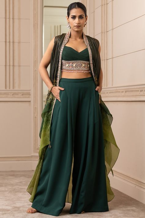 Featuring a mehendi green ombre cape in satin organza base with print and an embroidered collar. It is paired with matching georgette pants and an indian tulle bustier having thread, pearls, and sequins embroidery.   FIT: Fitted at bust and waist. COMPOSITION: Satin organza, Georgette, Indian tulle. CARE: Dry clean only. Dress Patern, Dotti Dresses, Marriage Preparation, Saree Inspiration, Simple Kurtis, Mehendi Outfit, Cape Set, Haldi Outfits, Mehendi Ceremony