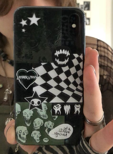 A person holding a phone in a mirror. There are multiple dark green cut out pictures on the back of their phone. Green Phonecases Aesthetic, Dark Phone Cases Aesthetic, Fairy Grunge Phone Case, Clear Phone Case Ideas Aesthetic Grunge, Phone Cases Grunge, Dark Green Stickers, Phone Cases Aesthetic Grunge, Green Phone Case Aesthetic, Phone Cases Dark