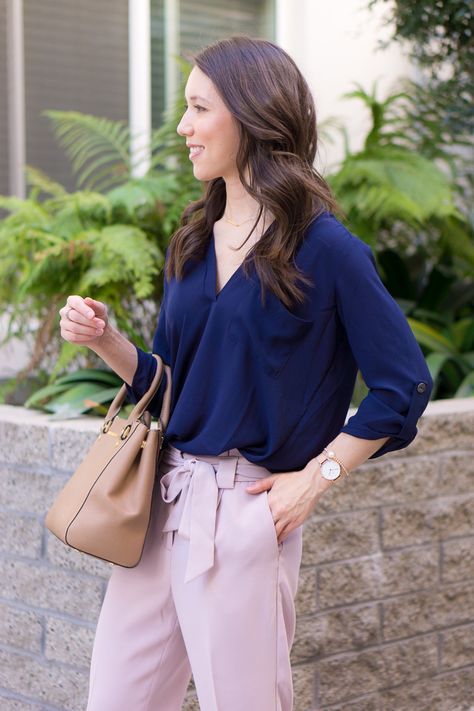 Two work outfits for early spring | Lavender pants | Blush pink high-waisted pants | Floral embroidered columnist black pants | Express petite fashion review | Petite style blog | Lush tunic blouse navy pink | Ann Taylor block sandals | Ivory heels | Springtime Summer outfit inspiration | rose gold bracelets accessories Pink And Navy Work Outfit, Rose Pink Top Outfit, Lavender Dress Pants Outfit, Lavender Trousers Outfit, Navy And Pink Outfit, Lavender Pants Outfit, Outfits For Early Spring, Navy Top Outfit, Florals Outfits