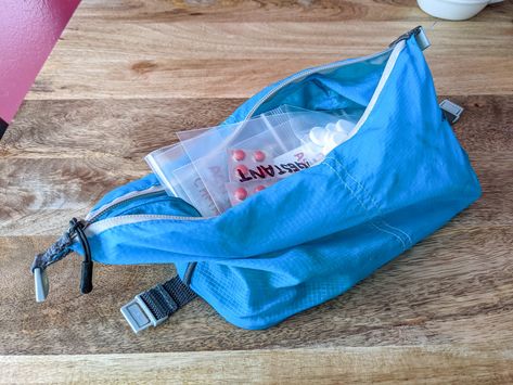 Supplements in a blue bag illustrate how to pack vitamins and supplements for travel. Minimalist Packing, Altitude Sickness, Packing Essentials, Vitamins And Supplements, Travel Container, Long Trips, Medical Prescription, Vitamins & Supplements, One Bag