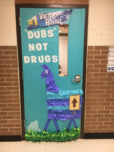 This year we went with a Fortnite theme for our Red Ribbon Week door decor. We used a Llama from the game with the tag line “Dubs Not Drugs”. We added the Victory Royale logo at the top. Red Ribbon Week Door Decorating Middle School, Red Ribbon Week Door Decorating Contest, Red Ribbon Week Door, Counselors Office, School Restroom, Classroom Decor Middle, School Volunteer, Classroom Decor High School, Door Decorating Contest