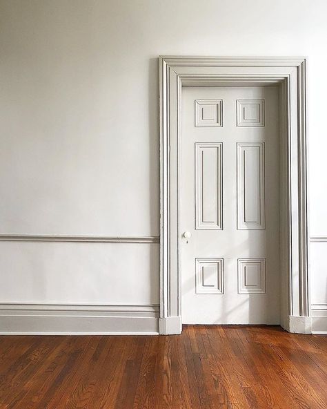 Painting the trim darker than the walls is a great way to be bold while sticking with neutral colors. #reverepewter #whitedove… White Wall Colored Trim, White Walls Darker Trim, House Character, Dark Doors, Dark Trim, Wall Trim, Painting Trim, March 3, Paint Colors For Home