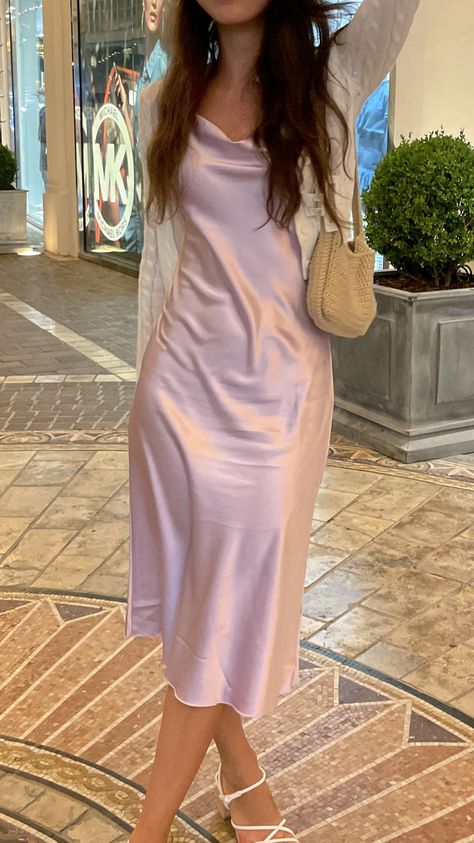 Silk dress with a crochet bag and claw clip in Los Angeles Aesthetic Birthday Party Outfits, Pink Silk Midi Dress, Pink Slip Dress Aesthetic, Silk Light Pink Dress, Pink Silk Long Dress, Pink Dress For Graduation, Pastel Silk Dress, Silk Dress Hoco, Prom Dress With Cardigan