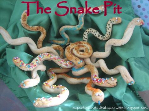 Has anyone tried snake before? I hadn't before I made these and I must say they taste a bit like scone! My son's eyes lit up when I showed ... Breadstick Snakes, Snake Breadsticks, Enchanted Kitchen, Egypt Party, Olive Eyes, Indiana Jones Birthday Party, Egyptian Themed Party, Indiana Jones Party, Egyptian Halloween