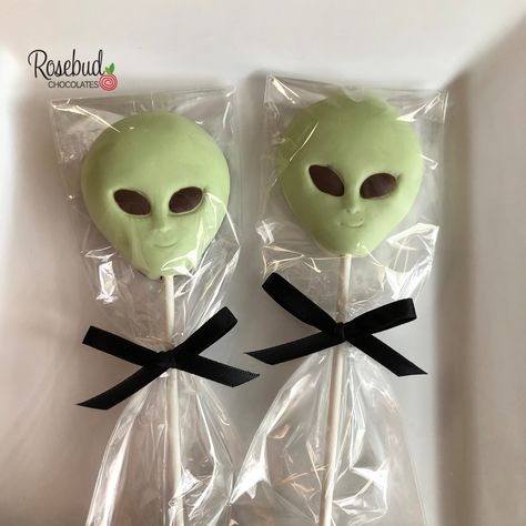 "PRODUCT DETAILS * One dozen (12) chocolate ALIEN lollipop favors. * Measures 2 1/4\" x 2 1/2\". * Individually heat sealed in a cellophane bag and tied with satin ribbon. * Please let us know any details regarding your order including RIBBON COLOR and EVENT DATE. Personalized favor tags and labels are available in our shop for an additional cost. PLACING YOUR ORDER When placing your order, PLEASE MAKE A NOTE OF THE EVENT DATE and details in the message box during checkout. This will ensure that Sweet 16 Candy Buffet, Alien Birthday Party, Sweet 16 Candy, Chocolate Party Favors, Lollipop Favors, Chocolate Lollipop, Lollipop Party, Alien Party, Dino Birthday Party