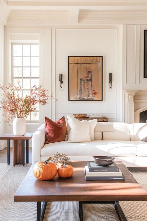 Fall Living Room Decor with fall faux stems and pumpkins on coffee table Minimalist Luxury Living Room, Indoor Fall Decorations, Neutral Fall Couch Pillows, Minimalist Apartment Decor, Indoor Fall Decor, Fall Apartment Decor, Luxury Couch, Fall Bedroom Ideas, Cozy Fall Bedroom