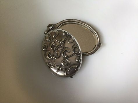 Silver-plated sliding double-mirrored locket with mistletoe motif, about 1-3/4" wide x 2-1/2" tall, alternate open view (asking US $233.29 on eBay, September 2020) Vintage Pocket Mirror, Pocket Mirror Aesthetic, Mirror Aesthetic, Jewelry Lookbook, My Themes, Pocket Mirror, Music Event, Compact Mirror, Jewelry Inspo