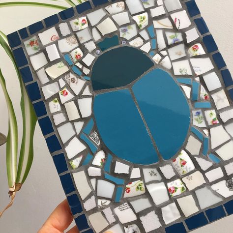 Luna Moon Mosaic on Instagram: “Scarab beetle meets spider-plant. Mosaic beetle made with recycled tiles, plates, millefiori and grey grout. #mosaic #ilovemosaic…” Recycled Tile, Grey Grout, Luna Moon, Scarab Beetle, Spider Plants, Grout, Stepping Stones, Mosaic, Recycling