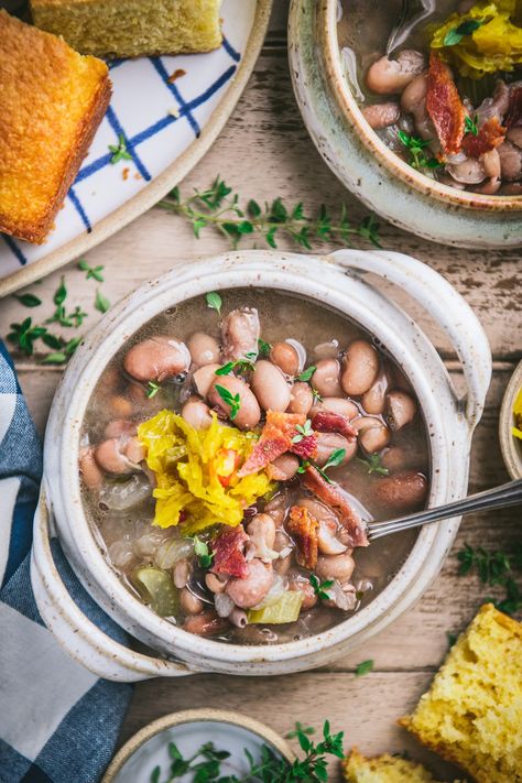 Simple, hearty, and flavorful, soup beans is a traditional Appalachian meal enjoyed for generations. The cozy and satisfying pinto bean soup is delicious topped with bacon, chow chow, or onions, and served alongside cornbread and greens. Prepare the classic dish in a Dutch oven or in a Crock Pot, and savor a taste of the mountain South! Pinto Bean Soup, Best Freezer Meals, Slow Cooker Times, Pinto Bean, Ragu Recipe, Soup Beans, Homemade Soup Recipe, Cooking Soup, Pinto Beans