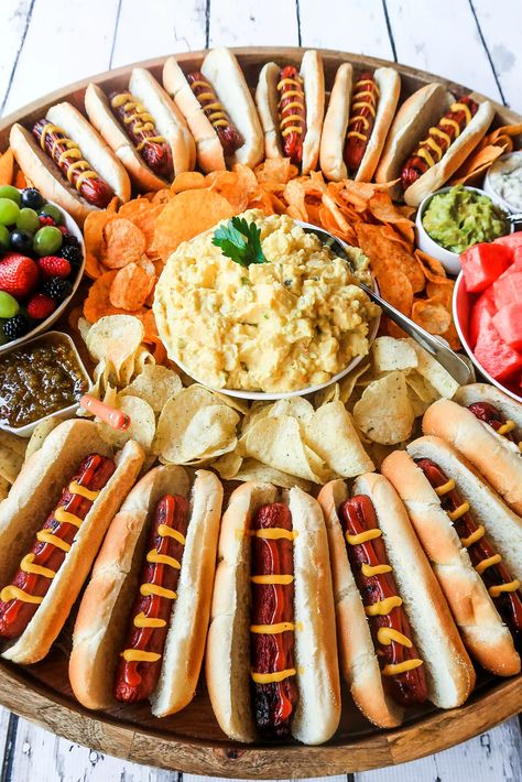 Epic Hot Dog Board for Twelve #epichotdogboard #hotdogs #hotdogboard Hot Dog Board, Hot Dog Party, Sour Cream Potatoes, Charcuterie Inspiration, Party Food Platters, Charcuterie And Cheese Board, Charcuterie Recipes, Dog Party, Potatoe Salad Recipe