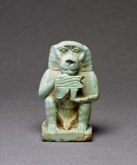 A baboon, identified with the ancient Egyptian god Thoth, holding an Eye of Horus symbol. (Walters Museum) Thoth Baboon, Egyptian Elements, Ancient Egyptian Deities, Egypt Museum, Late Period, Egyptian Deity, Egyptian Artifacts, Ancient Egyptian Gods, Ancient Egypt Art