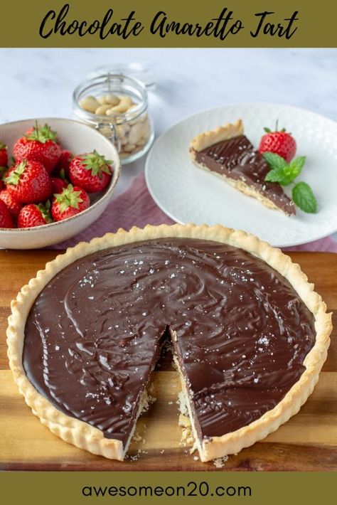 This Chocolate Amaretto Tart is pure indulgence. Rich amaretto-infused ganache paired with a flaky pastry crust are absolutely heavenly. This easy dessert recipe is perfect for a dinner party or date night. The post Chocolate Amaretto Tart appeared first on Awesome on 20. Chocolate Almond Pear Tart, Raspberry Ganache Tart, Vegan Frangipane Tart, Dark Chocolate Ganache Tart, Cherry Almond Frangipane Tart, Kitchen Magick, Cheeseburger Meatloaf, Drinks Summer, Clean Desserts