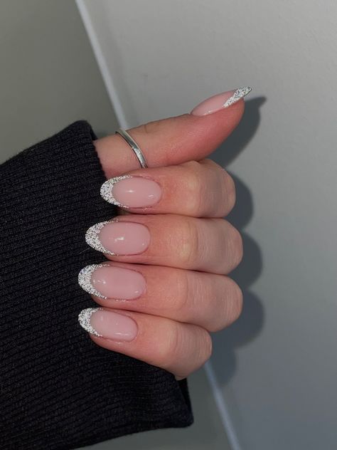 Glittery Almond French Tip, Glittered French Tips, White French Tips With Sparkle, Silver Sparkle French Tip Nails Almond, Sparkly White French Tip Nails Almond, Oval Glitter French Tip Nails, Silver Glitter French Tip Nails Almond, White Sparkle French Tip Nails Almond, Nail Ideas Silver Glitter