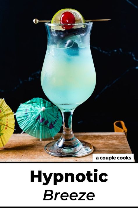 This Hpnotiq drink, the Hypnotic Breeze, stars the fruity blue liqueur with tropical flavors like pineapple and lime. It's a stunner! #hpnotiq #hypnotic #hypnoticdrink #hpnotiqdrink #hypnoticbreeze #beachdrink Hypnotic Drinks, Hpnotiq Drinks, Girls Night Drinks, Alcohol Spirits, Coconut Drinks, Blue Drinks, Yummy Alcoholic Drinks, Happy Hour Drinks, Couple Cooking