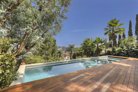 Outdoor, Decking Patio, Porch, Deck, Large Patio, Porch, Deck, Large Pools, Tubs, Shower, Back Yard, Trees, Shrubs, and Swimming Pools, Tubs, Shower The pool with a view. Photo 15 of 15 in A Thoughtfully Updated Hillside Home in L.A. Lists For $5.12M Wood Decking Around Pool, Pool With Wood Decking, Pool Built Into Deck, Pool Deck Wood, Pool With Wood Deck, Wood Deck Pool, Pool Hillside, Hillside Deck, Wood Pool Deck