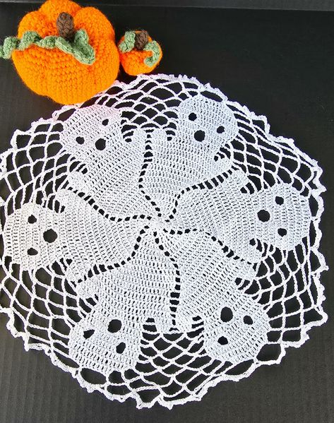 Thread crochet Halloween Ghost Doily https://blackmagicfiberarts.com/crochet-spooky-ghost-doily/ . . . . . . . . . . #HandmadeDoily #CrochetLace #GhostDesign #HalloweenDecor #SpookyElegance #ArtisanCraft #UniqueAccessories #FestiveDecor #TableCenterpiece #FancifulDesign #SeasonalDecor #GothicStyle #Handcrafted #FiberArt #HolidayDecor #CrochetCraft #EerieCharm #HalloweenDoily #SpookySeason #GhostMotif #ElegantLace #HandmadeHalloween #DecorativeDoily #HalloweenTable #GhostlyCharm #IntricateLace... Halloween Doily, Crocheted Halloween, Unique Hostess Gifts, Crochet Halloween, Ghost Design, Handmade Beauty Products, Halloween Table, Halloween Crochet, Thread Crochet