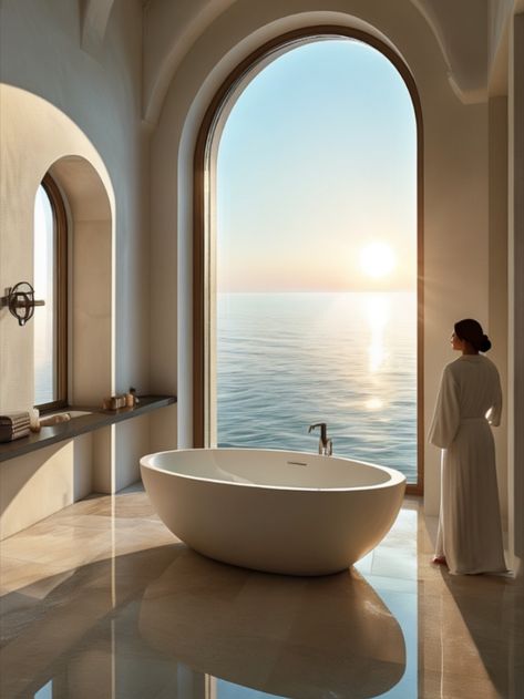 Mediterranean modern bathroom with a freestanding tub, large arched window framing the morning sun Window Framing, Bathroom Tub, Freestanding Tub, Arched Windows, Morning Sun, Window Frame, Free Standing Tub, Modern Bathroom, The Morning