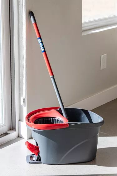 Spin Mop Cleaning Solution That Cleans Floors Like Crazy Tutorial | Hunker Best Homemade Mopping Solution, Moping Floors Cleaning, Spin Mop Cleaning Solution Diy, Spin Mop Floor Cleaner Recipe, O Cedar Spin Mop Cleaning Solution Diy, How To Mop Floors, Mop Bucket Cleaning Solution, Best Way To Clean Floors, Best Way To Mop Floors