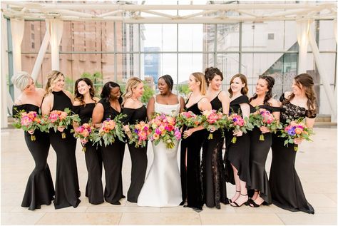 Black With Wildflowers Wedding, Stain Bridesmaid Dresses, Black Bridesmaid Dresses Bright Florals, Black With Bright Colors Wedding, Black Bridesmaid Colorful Flowers, Black Bridesmaid Dress With Colorful Flowers, Black Bridesmaid Dress Colorful Bouquet, Black Wildflower Wedding, Black Bridesmaid Dresses Colorful Bouquets