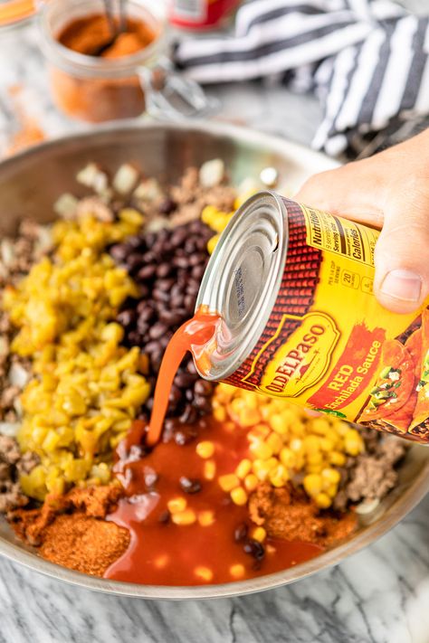 Cheesy Mexican Taco Tater Tot Casserole -- give this yummy taco tater tot casserole a try for your next Taco Tuesday! Taco-spiced saucy ground beef, canned black beans & corn, all topped off with crispy tater tots and cheese makes for an easy family-favorite dinner. #cansforcomfort #easyrecipe #casserole #casserolerecipes #casserolerecipeseasy #tatertots #tatertotcasserole #tacocasserole #tacotuesday #mexicancasserole Gator Tot Taco Casserole, Taco Casserole Bake With Tator Tots, Taco Bake With Tater Tots, Taco Tator Casserole, Southwest Tater Tot Casserole, Tatter Tots Casserole Taco, Enchilada Tater Tot Casserole, Tator Tot Taco Bake, Taco Tatertot Casserole Recipe Beef