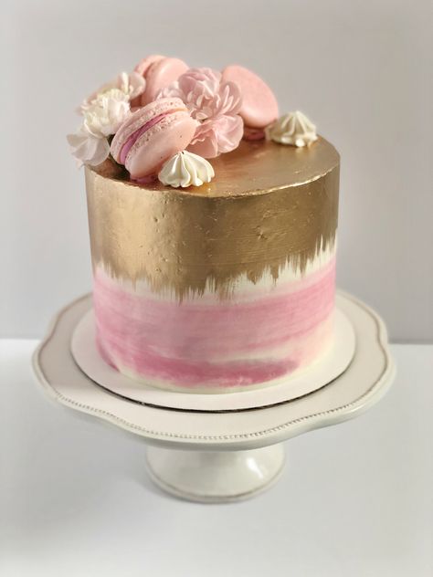 Pink cake with gold painted on top and down the sides, topped with macarons, meringues and flowers. Pink Cake With Macarons, Birthday Cake With Macarons On Top, Gold Ombre Cake, Cake With Macarons On Top, Macaron Cakes, Cake With Macarons, Cake With Gold, 11 Birthday, Macaron Cake