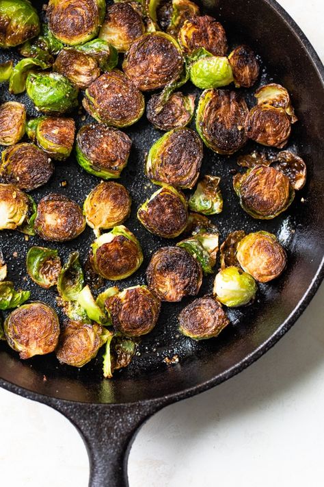 The BEST and easiest Fried Brussels Sprouts recipe. They're fried in a skillet, then baked in the oven so they're crispy on the outside but soft on the inside #brusselssprouts Brussel Sprouts Fried, Brussel Sprout Skillet Recipes, Brussel Sprouts In Skillet, Skillet Brussel Sprout Recipes, Pan Fried Brussel Sprouts Crispy, Fried Brussel Sprout Recipes, Fried Brussel Sprouts Crispy, Brussel Sprouts Skillet, Skillet Brussel Sprouts