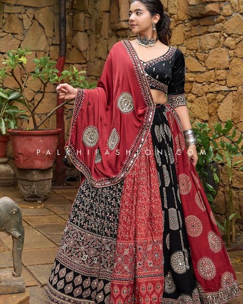 🖤❤️ Embrace the vibrant spirit of Gujarat with our Black & Maroon Ajarakh Designer Navratri Chaniya Choli! ❤️🖤 This exquisite ensemble features timeless Ajarakh prints, intricate multi-color embroidery, mirror work, and traditional motifs. The matching embroidered blouse and maroon dupatta complete this captivating look, perfect for making a statement this Navratri. ✨ Shop now at Palkhi Fashion and experience the magic of Ajarakh! ✨ Learn More :- https://palkhi.us/link #PalkhiFashion #Nav... Lehenga With Mirror Work, Navratri Blouse, Dandiya Night, Gamthi Work, Maroon Dupatta, Navratri Outfits, Kutchi Work, Palkhi Fashion, Navratri Lehenga