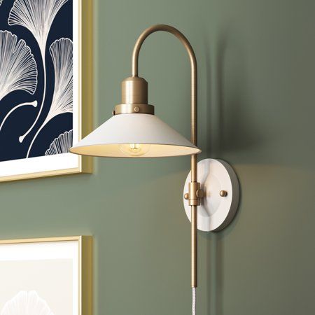 Install Reta to jazz up your reading nook. It's single-light wall mounted lamp, perfect for your bedside or living room. This wall sconce features a cone-shaped opal milk glass shade, which diffuses the light out, making it ideal for work stations and reading corners. The glazed back plate with vintaged brass details give that minimalist modern feel, so it blends beautifully to almost any home decor style. The Reta light fixture also gives character to your kitchen or dining space, hallway or en Nathan James, Plug In Wall Lights, White Light Fixture, Bedroom Light Fixtures, Wall Light Fixture, Wall Sconces Bedroom, Wall Mounted Lamps, Glass Wall Lights, Light Fixtures Flush Mount