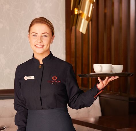 Food and Beverage uniform, bespoke tunic and apron, Clayton Hotels, UK and Ireland. Modern Restaurant Uniforms, Hotel Staff Uniform Receptionist, Front Desk Uniform Hotel, Bar Staff Uniform, Uniform Hotel, Waiter Uniform Modern, Steward Uniform Hotel, Luxury Hotel Staff Uniform, Angelina Cafe