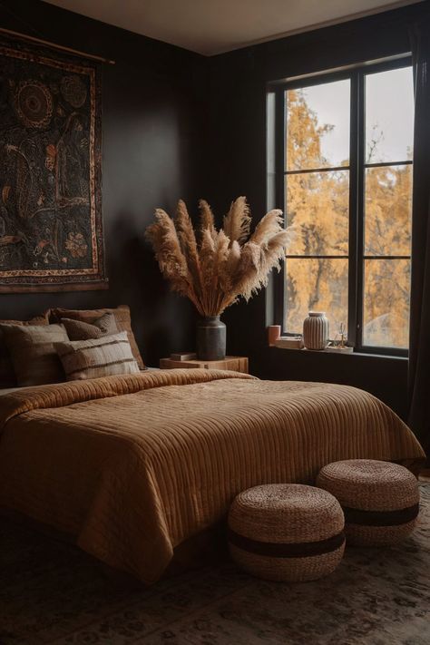 Boho-style bedroom featuring earthy tones, pampas grass by the window, and two woven ottomans Garage Airbnb, Moody Transitional, Moody Eclectic Bedroom, Tan Bedroom Ideas, Moody Boho Bedroom, Moody Bedroom Design, Moody Bedroom Decor, Mauve Bedroom, Boho Moody