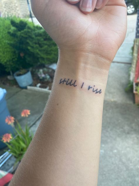 Still I Rise Tattoo With Cross, Still I Rise Wrist Tattoo, But Still I Rise Tattoo, Im Still Here Tattoo, Still I Rise Tattoos For Women, Still I Rise Tattoo Design, And Still I Rise Tattoo, Still I Rise Tattoo Fonts, Still Here Tattoo