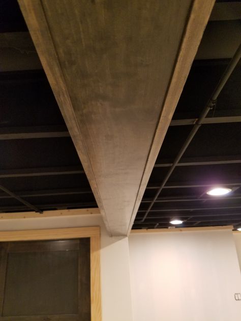 Pine material to cover metal beam in basement stained to match interior doors Basement Ceiling Ideas, House Basement, Metal Beam, Support Beam, Basement House, Basement Ceiling, Ceiling Ideas, Basement Remodel, Finished Basement