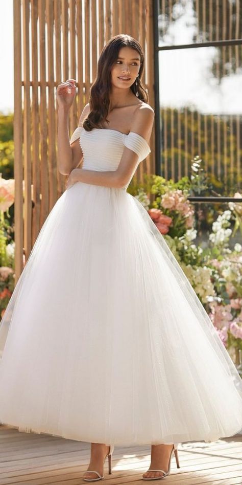 Tea Length Wedding Dresses — Timeless Elegance ★ #bridalgown #weddingdress Mid Length Wedding Dress Modern, Tulle Tea Length Wedding Dress, Tea Length Tulle Wedding Dress, Midi Wedding Dress Tea Length, Tea Length White Dress, Cup Wedding Dress, Mid Length Wedding Dress, Halter Top Wedding Dress, Tea Length Wedding Dresses