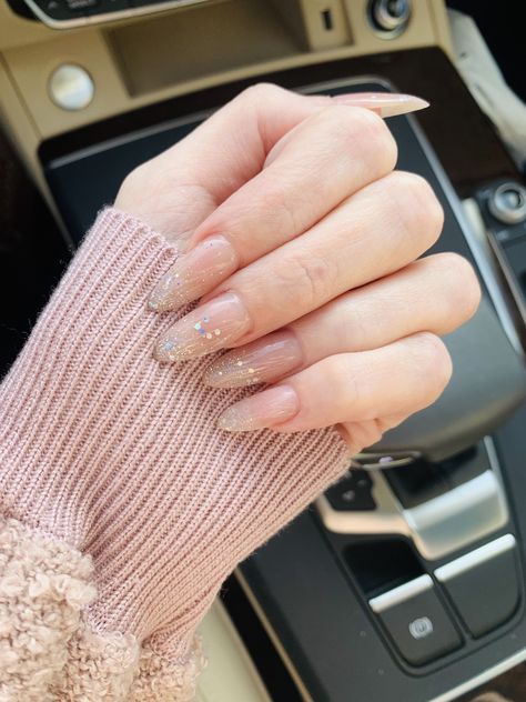 Nude with glitter ombré almondetto nails! Perfect for holidays, parties, New Year’s Eve, etc. Party Nails Almond Shape, Almond Party Nails, Nude With Gold Glitter Nails, Nude Party Nails, New Years Acrylic Nails Sparkle, Nude Holiday Nails Almond, Nude Nails Glitter Tips, Almond Nude Nails With Glitter, Nude Nails With Glitter Tips