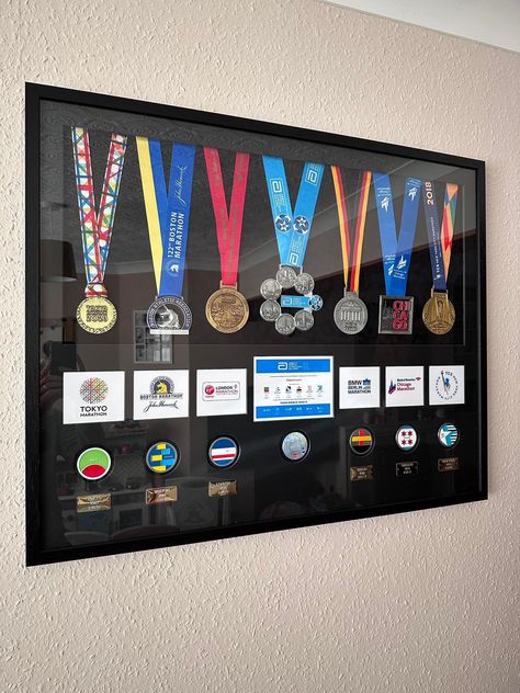 Ironman Medal Display, Aesthetic Medal Display, Medal Decoration Ideas, Marathon Frame Medal Displays, Track Medal Display Ideas, Marathon Vision Board, Sports Medal Display Ideas, Athletic Room Ideas, Medals Display Ideas