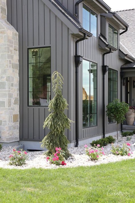 Monotone Exterior House Paint, Woodtone Siding Aspen Ridge, Iron Ore Farmhouse Exterior, Simple Modern Home Exterior, Porch Different Color Than House, Medium Gray House Exterior, Light Grey House Black Windows, Gray Vertical Siding Exterior, Light Grey Barndominium Exterior