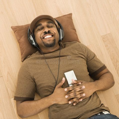 Man relaxing to music. African-American mid-adult man wearing headphones and lis , #Aff, #American, #mid, #adult, #African, #Man #ad Man Wearing Headphones, Man Relaxing, Relaxing Images, Wearing Headphones, Wearing Headphone, Mockups Design, African Men, Mp3 Player, Mockup Design