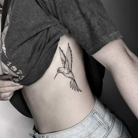 Hummingbird Tattoo Sternum, Hummingbird Side Tattoo, Angel Hummingbird Tattoo, Hummingbird Tattoo On Leg, Below Chest Tattoo Female, Woman Inner Bicep Tattoo, Wildflower Hummingbird Tattoo, Humming Bird Shoulder Tattoos For Women, Hummingbird Daisy Tattoo