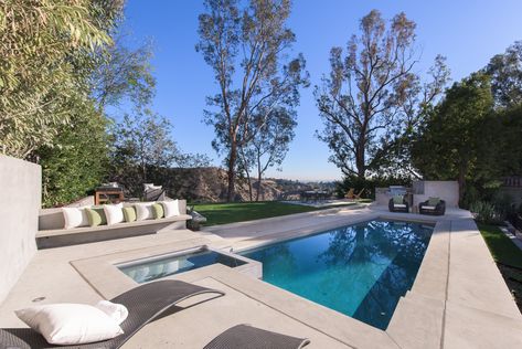 An outdoor kitchen, green lawn and pool makes the rear-yard the perfect spot of outdoor soirees. Plunge Pools, Kitchen Green, Tub Pools, Small Pools, Hollywood Sign, Hottest Chili Pepper, Plunge Pool, Green Lawn, Hot Tub Outdoor