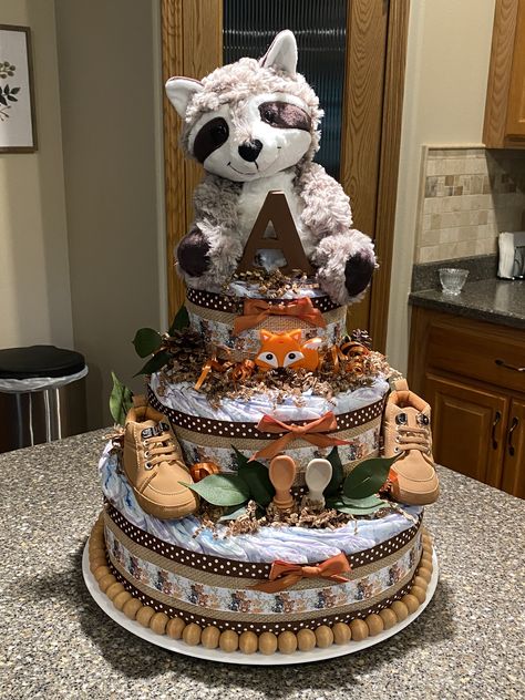 Woodland Diaper Cake Ideas, Woodland Diaper Cake, Gender Reveal Cake Woodland Theme, Raccoon Baby Shower Ideas, Woodland Theme Diaper Cake, Raccoon Cake Pop, Raccoon Themed Nursery, Woodland Baby Shower Theme Boy Forest Animals Diaper Cakes, Creative Baby Shower Themes