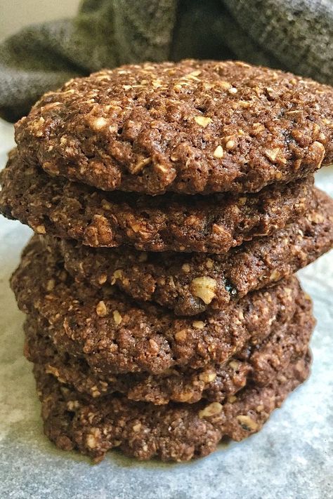 Oats and lots of chocolate together spells a cookie that's hard to resist! This Eggless Chocolate Oatmeal Cookie balances between health and taste perfectly. The chocolate chips melt to create a delightful fudgy, soft & chewy texture. The recipe is easy & is pretty straightforward too and needs only a few kitchen staple ingredients namely Instant oats, flour, sugar, butter, cocoa, chocolate chips, etc. Read the full recipe on my blog. | Cookie Recipes | chocolate cookie recipes Oatmeal Cookies Without Eggs, Healthy Chocolate Oatmeal, Apple Crumble With Oats, Homemade Cookie Recipes, Rose And Pistachio, Easy Homemade Cookie Recipes, Pistachio Shortbread Cookies, Cookies Without Eggs, Easy Apple Crumble